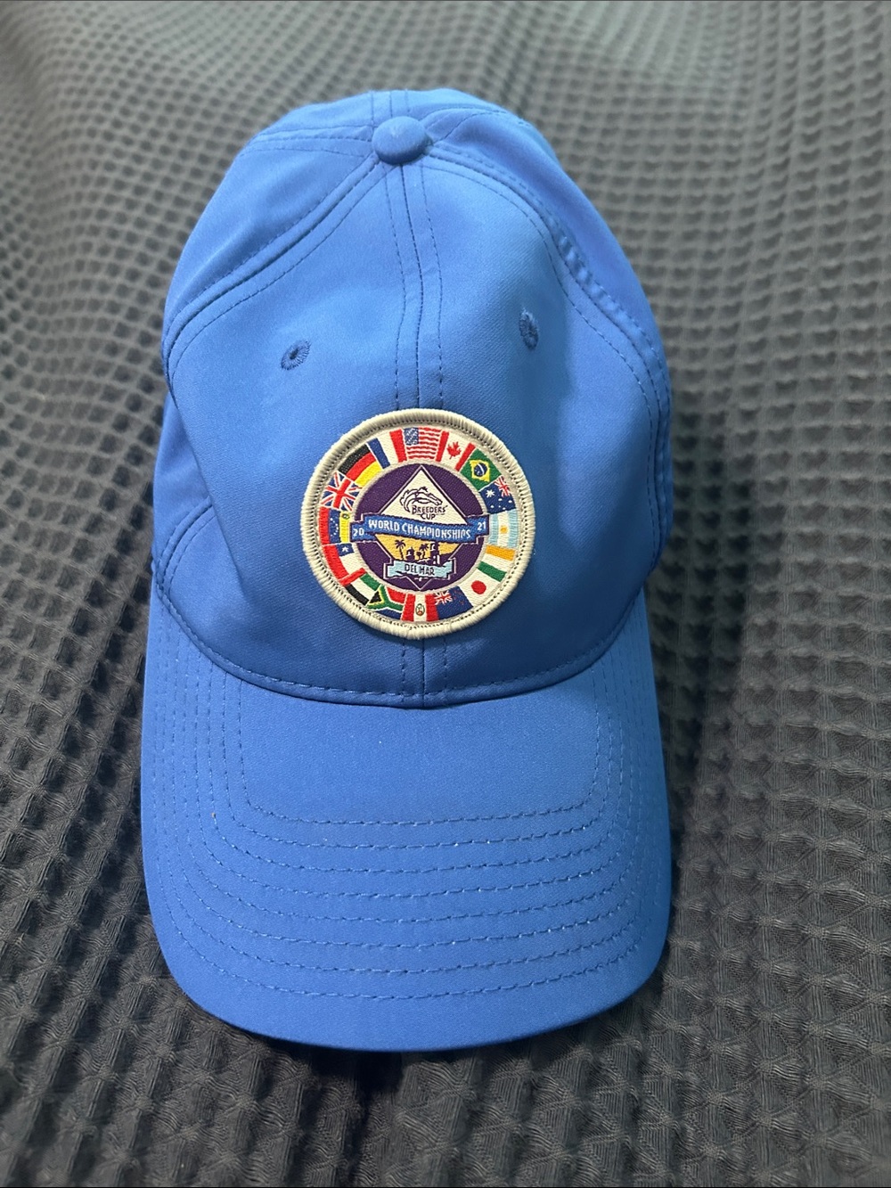 Blue Baseball Cap with Multi-Flag Championship Patch